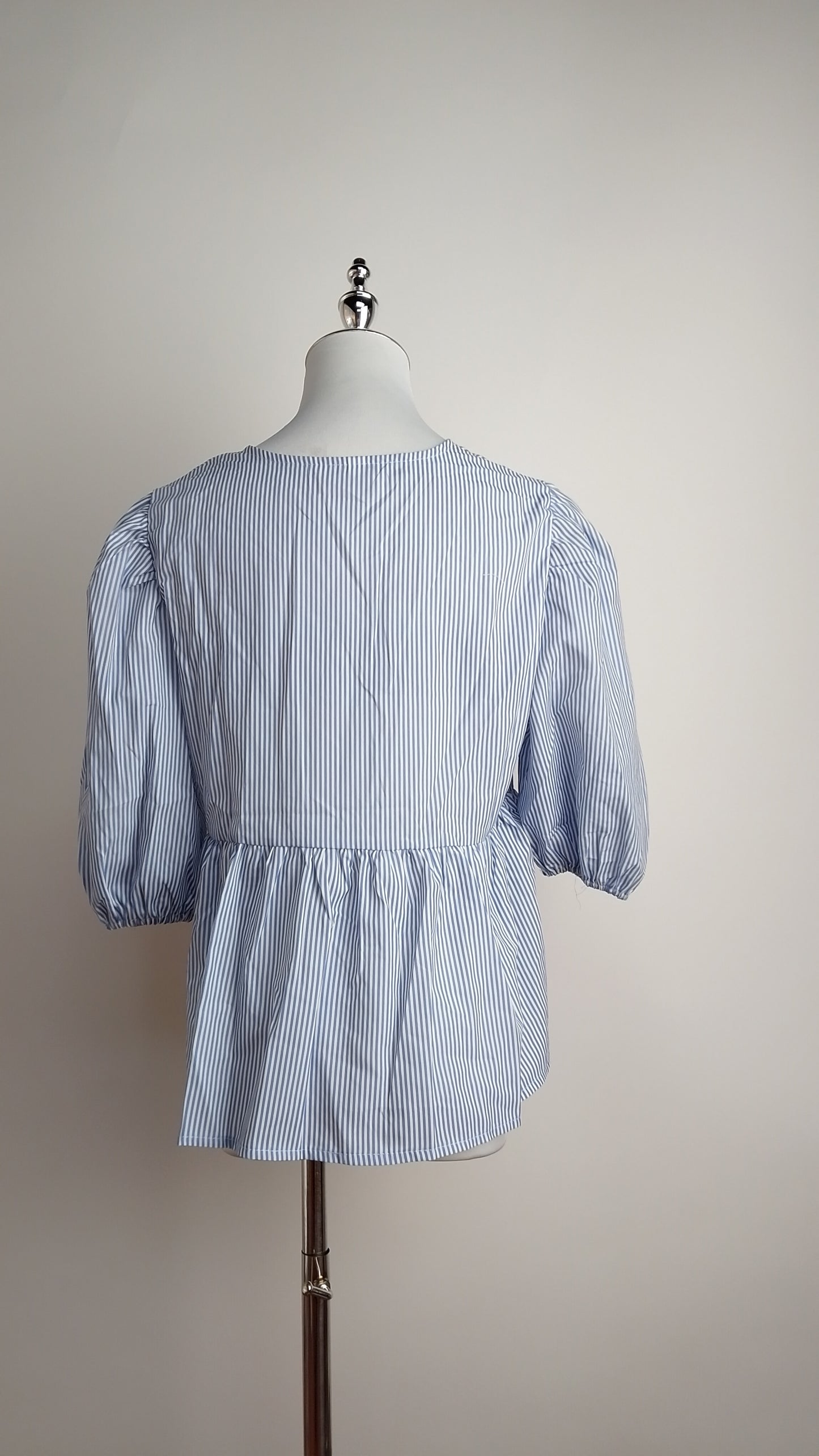 Blusa celeste manga corta lazo / ANB15